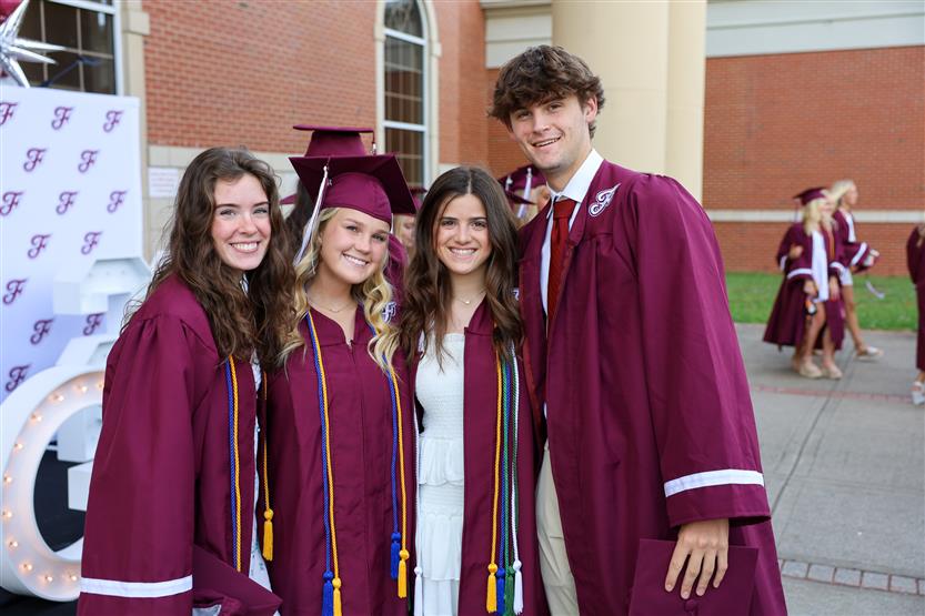 Graduates wearing maroon robes